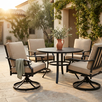 5-Piece Metal Outdoor Dining Set with Beige Cushions and Swivel Dining Chairs — Studio Shot